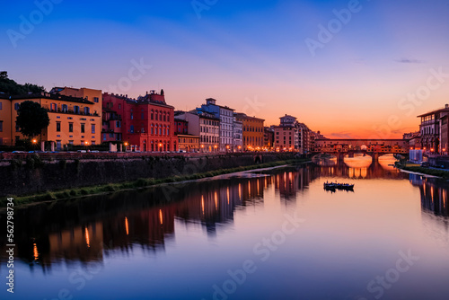 Famous Ponte Vecchio bridge on the river Arno River at sunset, Florence, Italy