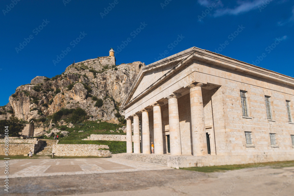 View of Old Venetian Fortress of Corfu, Palaio Frourio, Kerkyra old town, Greece, Ionian sea islands, with the lighthouse, Clock tower, st. George church and the city, a blue sky summer sunny day