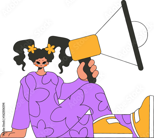 A young girl sits on the floor and holds a megaphone.