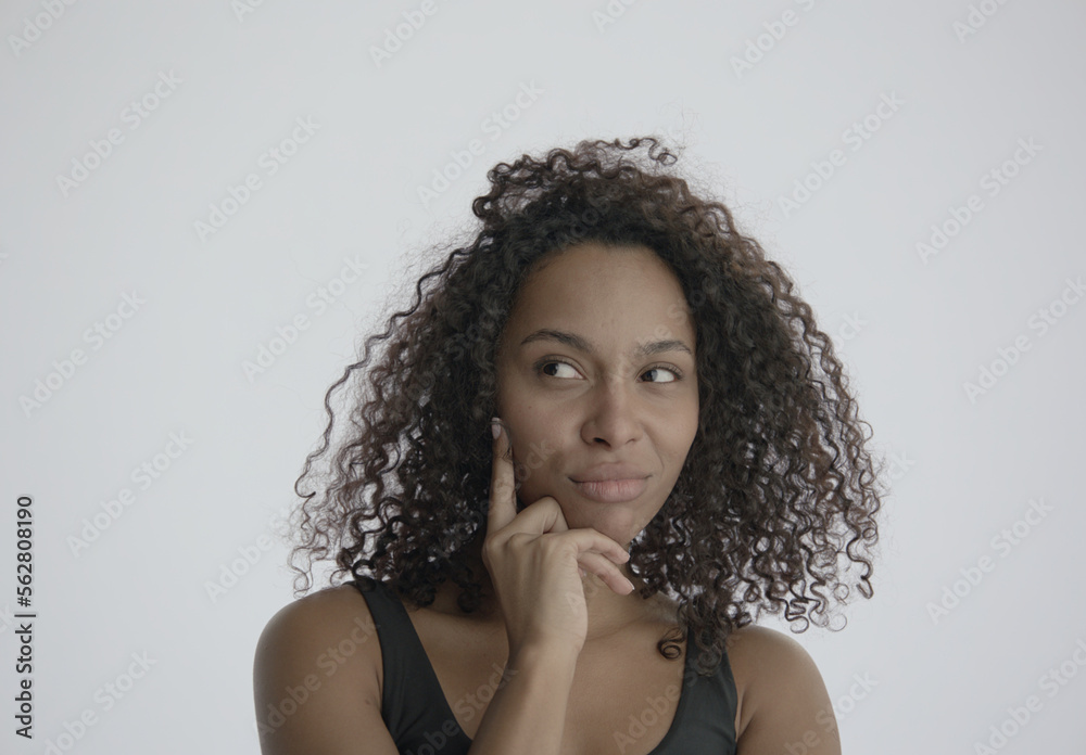 CU Headshot portrait of beautiful 20s African-American Black female posing against white background, no make-up, clean skin. Shot with ARRI Alexa Mini LF CU Headshot portrait of beautiful 20s African-American Black female posing against white background, no make-up, clean skin. Shot with ARRI Alexa Mini LF