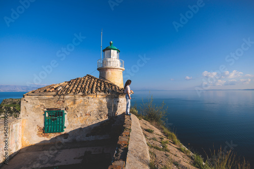 View of Old Venetian Fortress of Corfu, Palaio Frourio, Kerkyra old town, Greece, Ionian sea islands, with the lighthouse, Clock tower, st. George church and the city, a blue sky summer sunny day photo