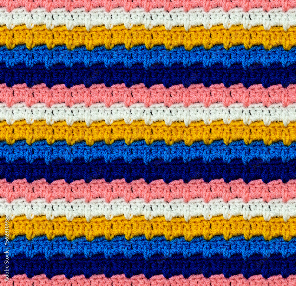 Seamless knitted pattern crocheted from bright acrylic yarn. Pixel style. Ethnic color motifs.