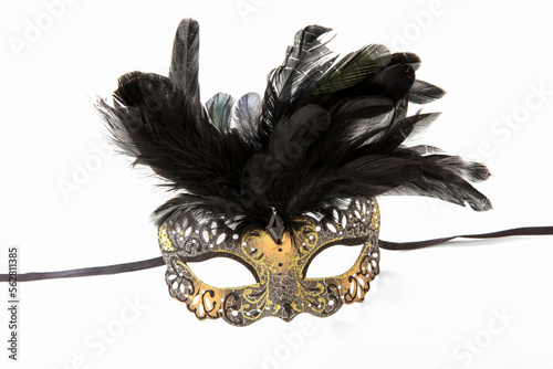 Carnival Venetian mask with black feather decoration isolated on white