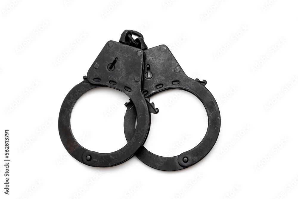 metal police handcuffs in black on a white background metal police handcuffs in black on a white background
