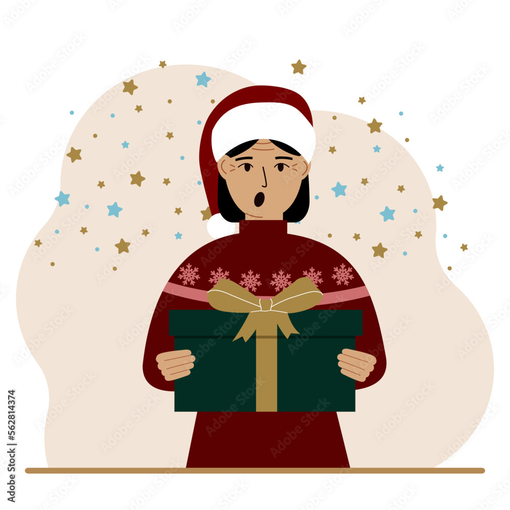 A woman with a New Year's gift. Concept of preparing for Christmas, new year, receiving a gift, christmas sale or secret santa claus. A woman with a New Year's gift. Concept of preparing for Christmas, new year, receiving a gift, christmas sale or secret santa claus.