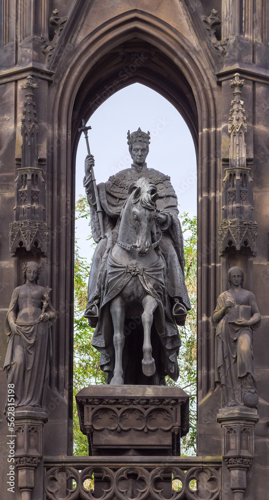 Fototapeta premium Kranner's Fountain or the Hold of Czech Estates, Prague. Monument with equestrian statue of Emperor Francis I in neo-Gothic style located in the National Awakening Park on the Smetana Embankment.