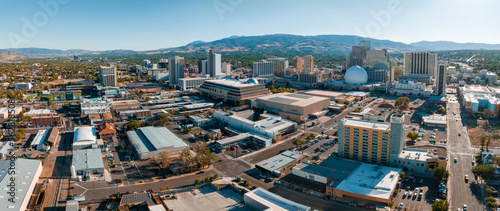 Panoramic aerial view of the city of Reno cityscape in Nevada. Downtown Reno, Nevada, with hotels, casinos and the surrounding High Eastern Sierra foothills.