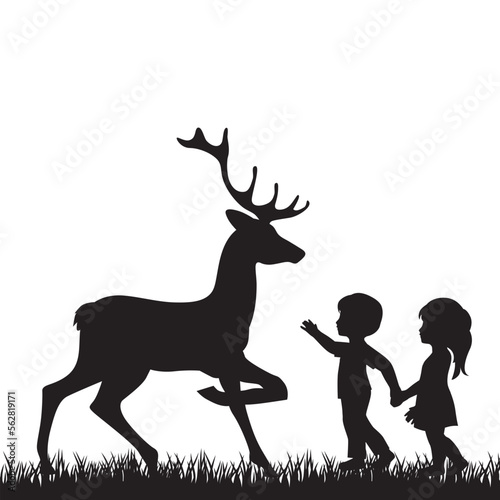 little boy and girl with deer