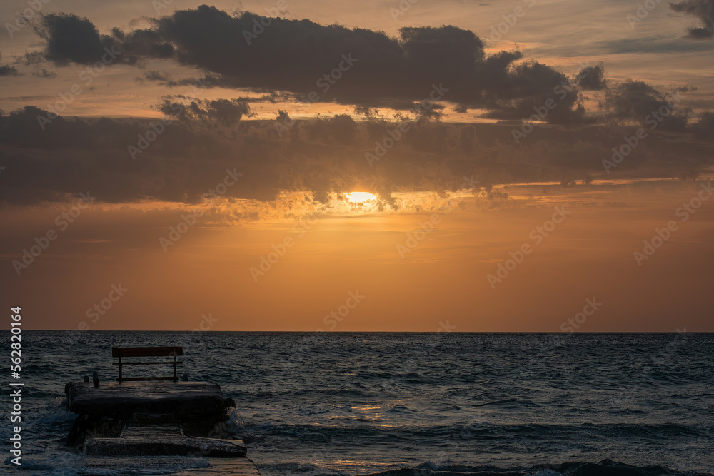 Beautiful sunset with stormy sea during a windy day in Corfu island, Greece Beautiful sunset with stormy sea during a windy day in Corfu island, Greece