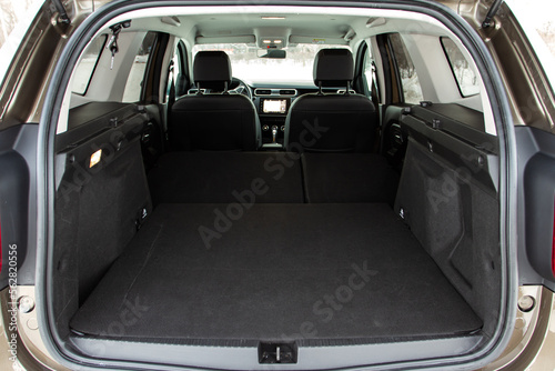 Huge, clean and empty car trunk in interior of compact suv. Rear view of a SUV car with open trunk