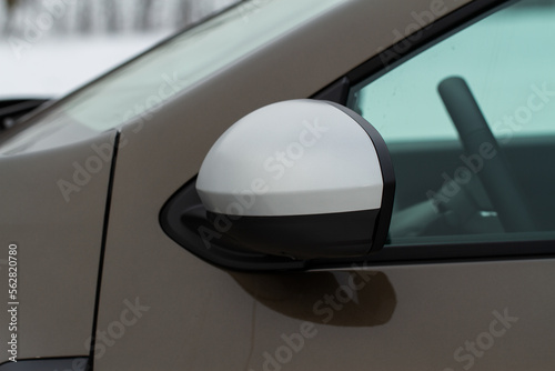 Side rear-view mirror on a modern car. Closeup photo of  a car mirror. Close up front side view of rear view mirror.