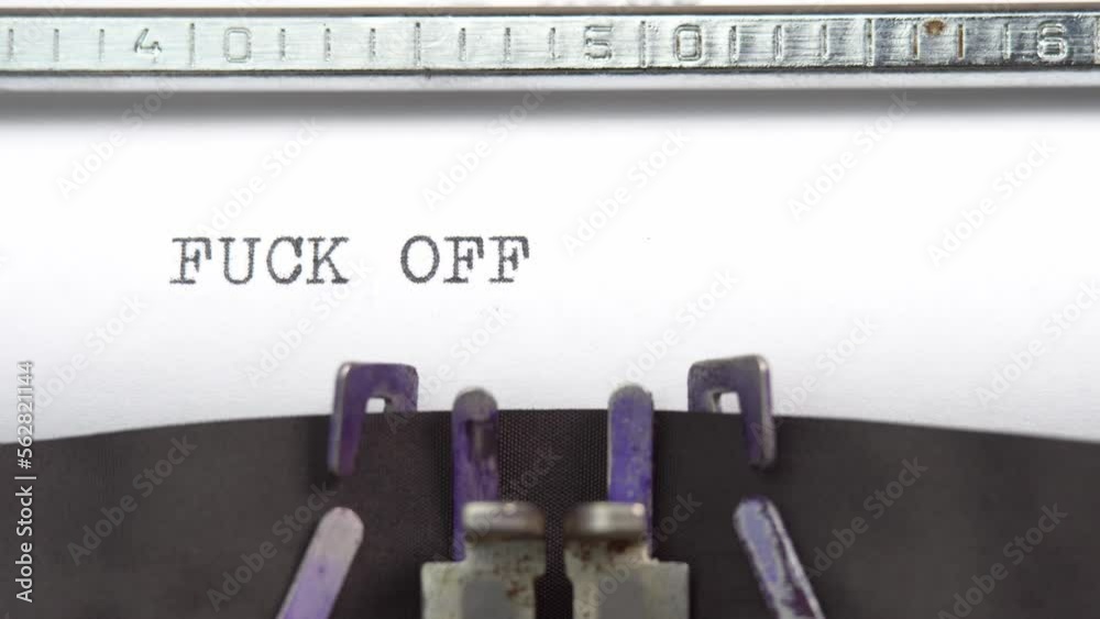 Fuck off phrase closeup being typing and centered on a sheet of paper on old vintage typewriter mechanical Fuck off phrase closeup being typing and centered on a sheet of paper on old vintage typewriter mechanical