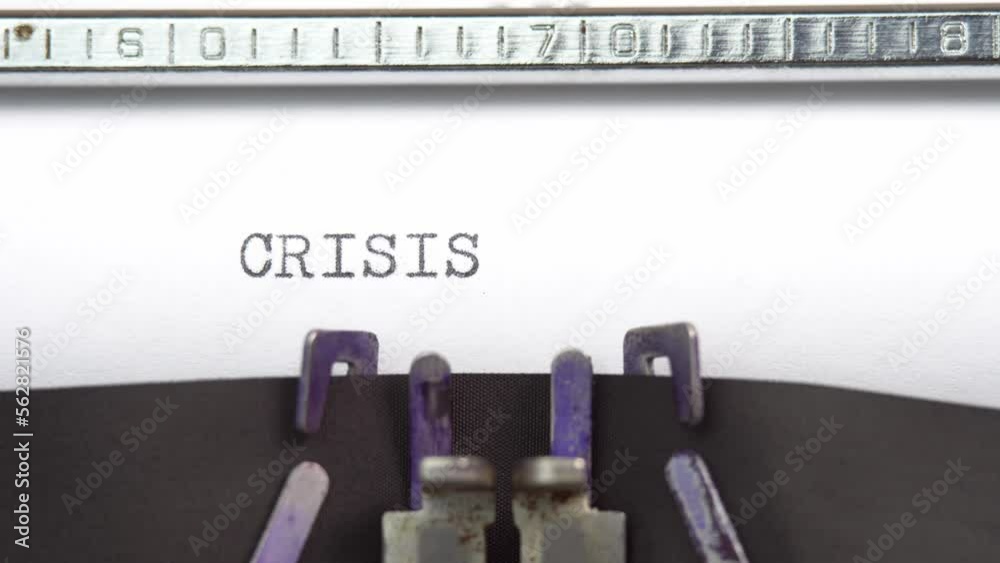 Crisis word closeup being typing and centered on a sheet of paper on old vintage typewriter mechanical Crisis word closeup being typing and centered on a sheet of paper on old vintage typewriter mechanical