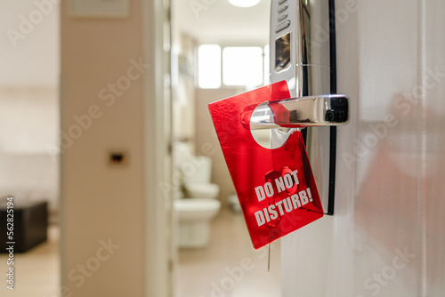 do not disturb sign on the motel or hotel room door handle