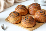 buns with poppy seeds, sweet pastries, flour products on the table.