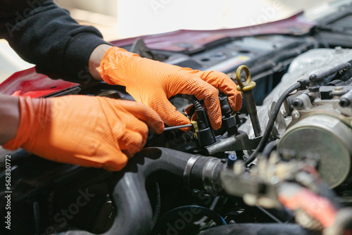 Car mechanic working in a garage