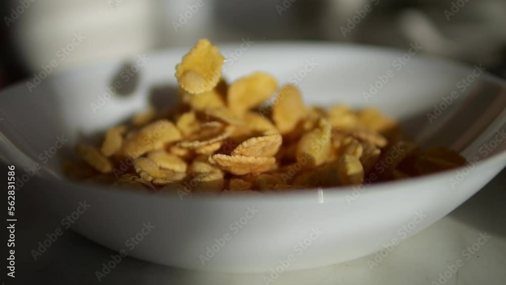 Morning breakfast. Pour cornflakes into a plate early in the morning. Quick breakfast with milk. Morning breakfast. Pour cornflakes into a plate early in the morning. Quick breakfast with milk.