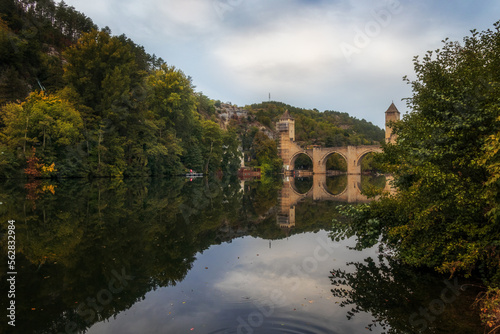 The river Lot and the stone arched bridge of Valentre. Cahors, Occitania, France.