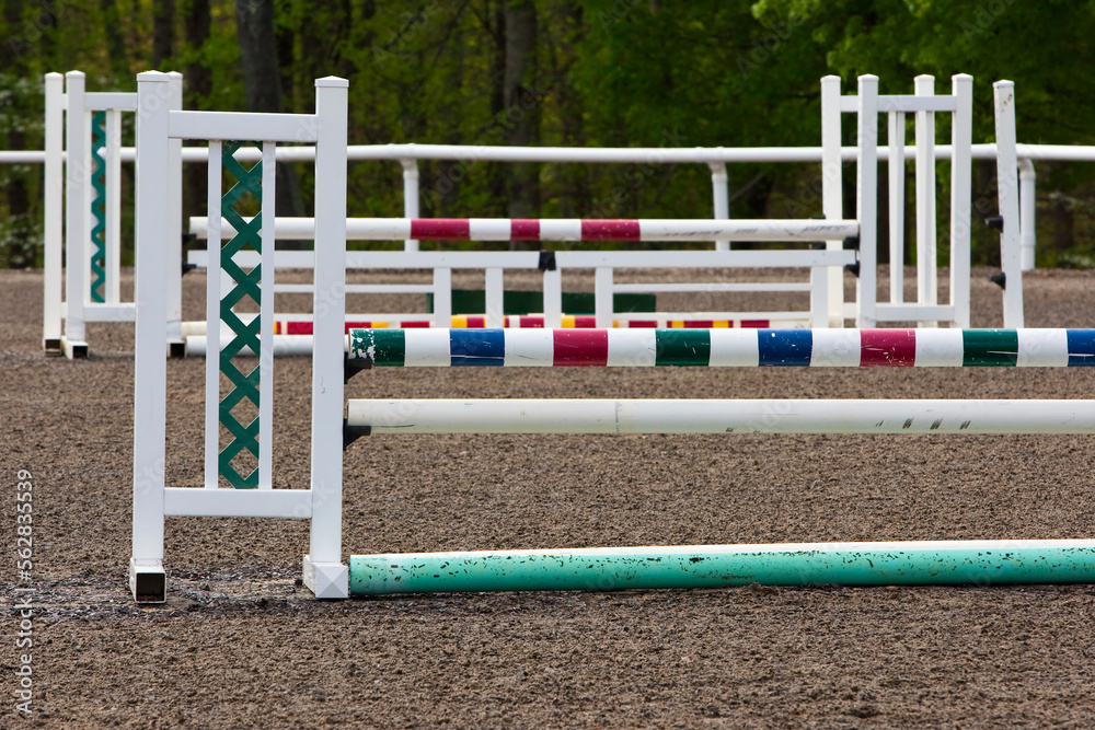 A Group Of Multiple Horse Jumps Inside An Equestrian Ring Before A Show A Group Of Multiple Horse Jumps Inside An Equestrian Ring Before A Show