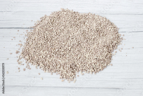 granulated aromatic cat litter on a light background photo