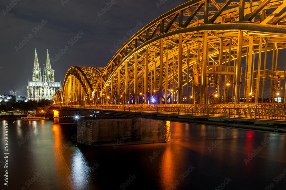 Fototapeta premium Night Cologne Cityscape with Cologne Cathedral and Hohenzollern Bridge. Germany. Long Exposure.