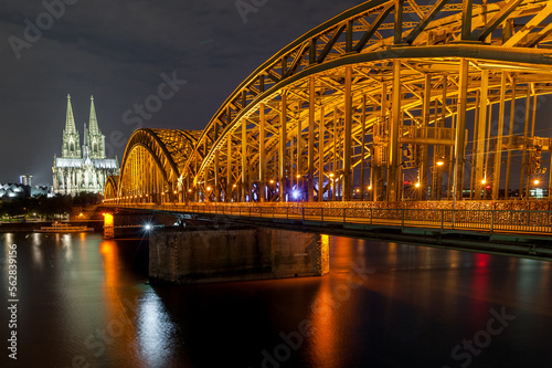 Night Cologne Cityscape with Cologne Cathedral and Hohenzollern Bridge. Germany. Long Exposure. photo