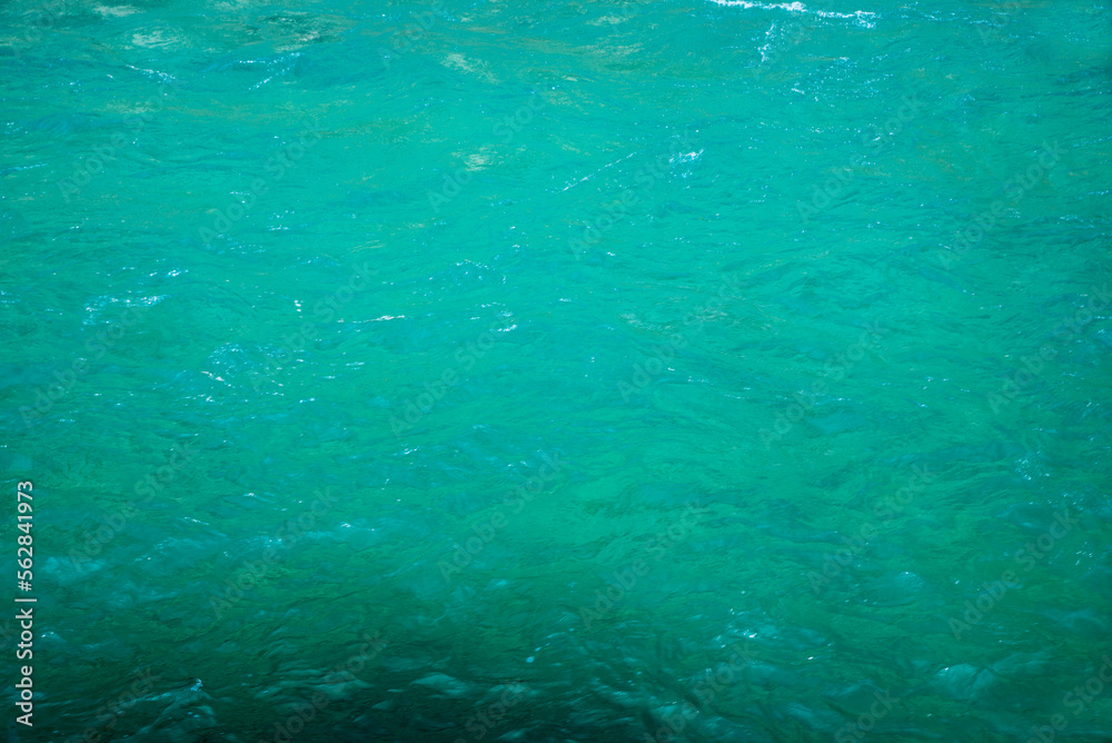 water surface of a turquoise river
