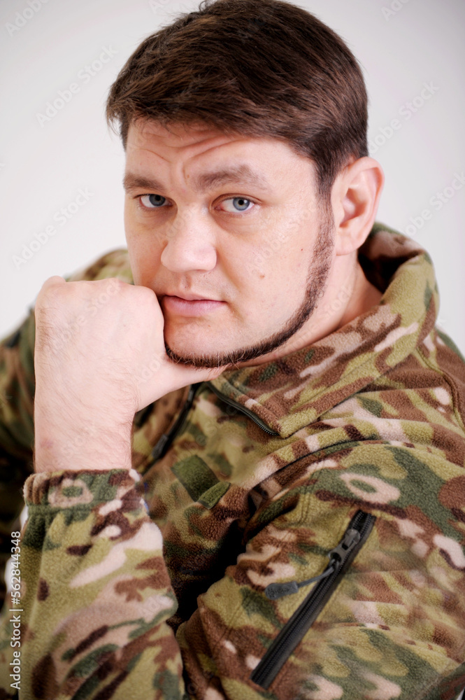 Ukrainian soldier wearing military uniform with flag and chevron