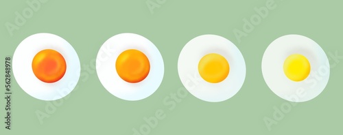 Obraz na płótnie Four fried eggs in different qualities isolated on green background