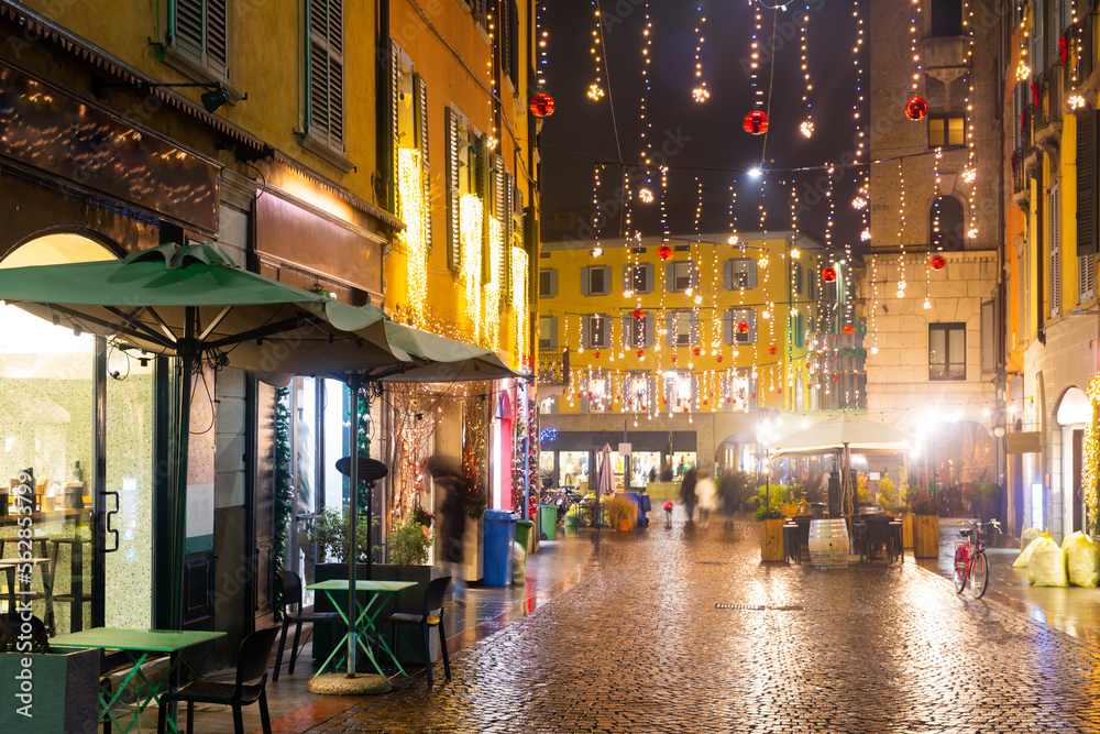 Christmas decorated streets of Italian city Bergamo in evening.