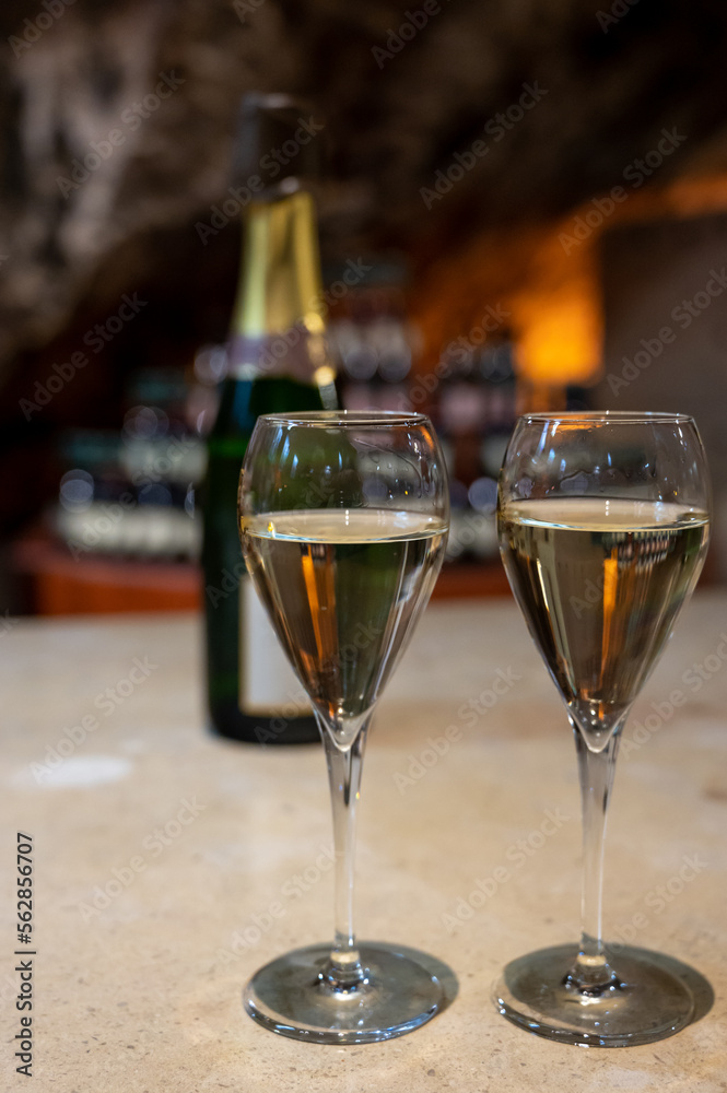 Tasting of rose champagne sparkling wine produced by traditional method in underground caves in Champagne, France Tasting of rose champagne sparkling wine produced by traditional method in underground caves in Champagne, France