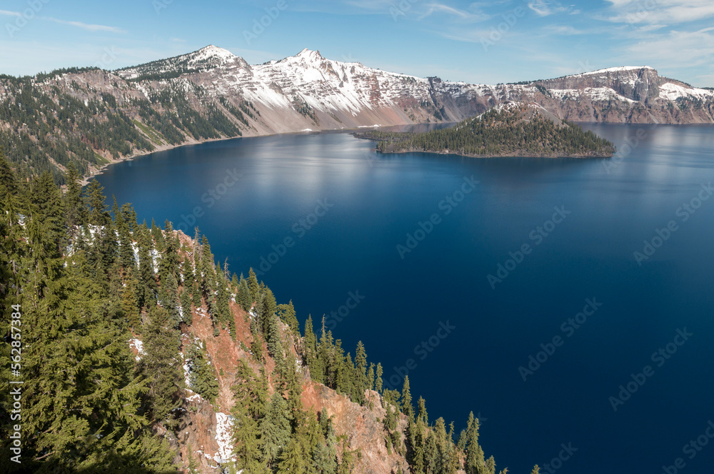 partly snowy landscape of the Crater Lake National Park, Oregon, USA