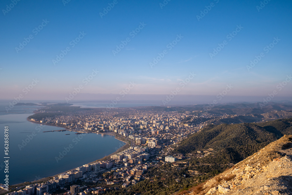 Attractive spring cityscape of Vlore city from Kanines fortress. Captivating morning sescape of Adriatic sea. Spectacular outdoor scene of Albania, Europe. Traveling concept background. Attractive spring cityscape of Vlore city from Kanines fortress. Captivating morning sescape of Adriatic sea. Spectacular outdoor scene of Albania, Europe. Traveling concept background.