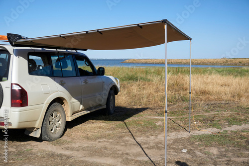 Side Awning setup to provide shade during summer, when camping,