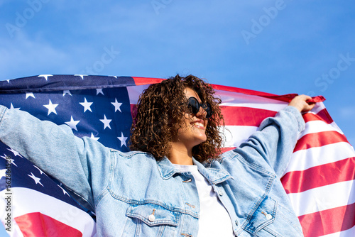 Slim beautiful woman holding USA flag