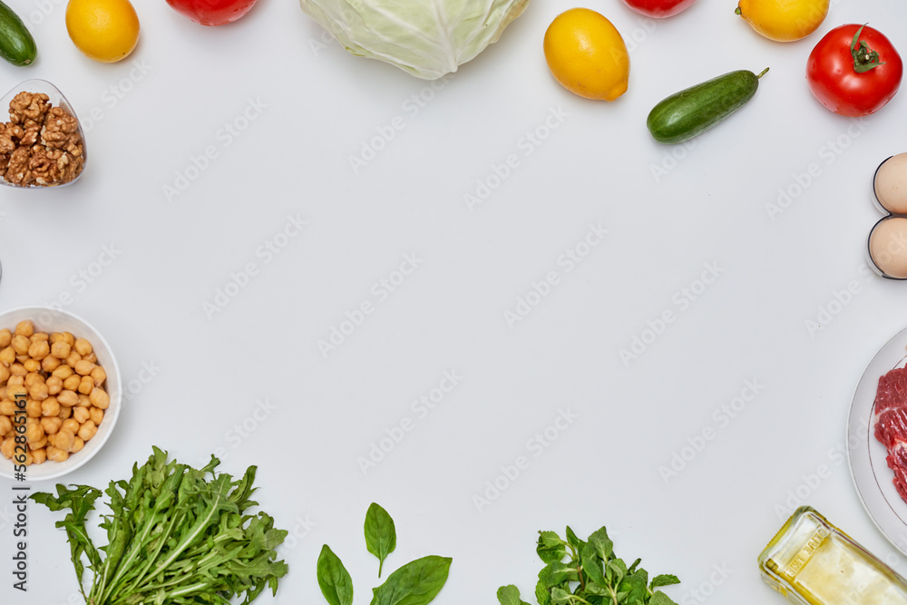 some vegetables and fruits on a white surface with space for your text or image to be displayed in the center