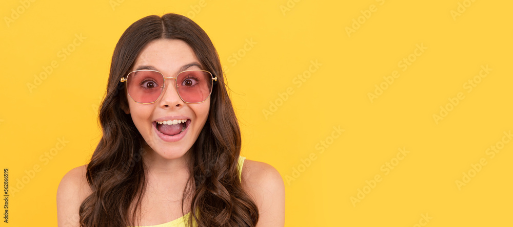 amazed teen girl in summer glasses has curly hair on yellow background, amazement and surprise. Child face, horizontal poster, teenager girl isolated portrait, banner with copy space. amazed teen girl in summer glasses has curly hair on yellow background, amazement and surprise. Child face, horizontal poster, teenager girl isolated portrait, banner with copy space.
