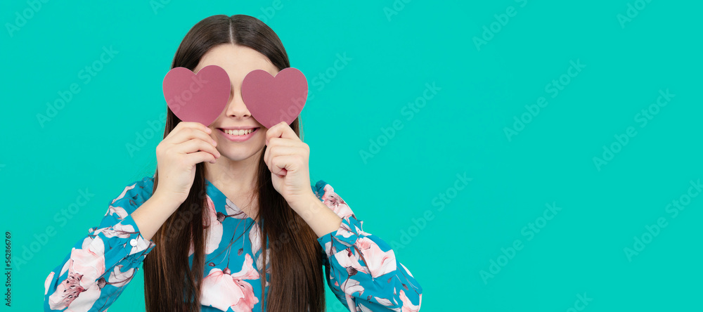 smiling kid hold red heart symbol of love for valentines day, mothers day. Kid girl portrait with heart love symbol, horizontal poster. Banner header with copy space. smiling kid hold red heart symbol of love for valentines day, mothers day. Kid girl portrait with heart love symbol, horizontal poster. Banner header with copy space.