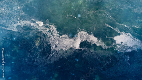Aerial view of mucilage on the sea. Dirty sea with toxic poisonous waste. Sea snot. Selective focus. Noise and grain included.