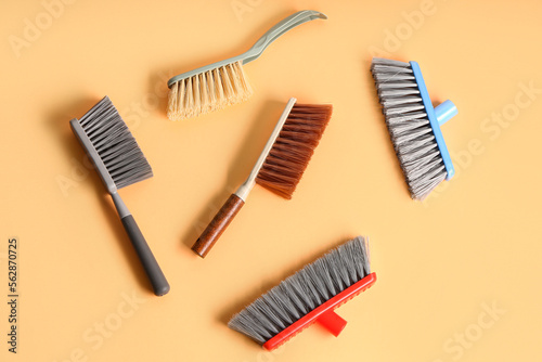 Set of cleaning brushes on color background