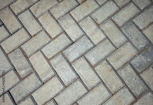 Paving block material that is commonly used for roads or outdoor areas. Stone blocks seamless texture.