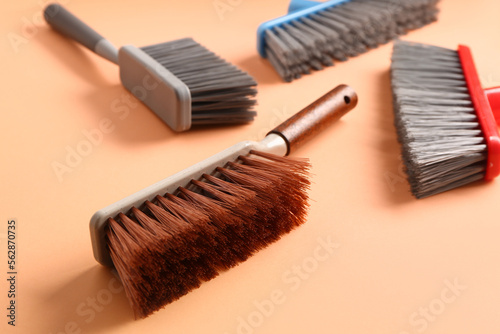 Set of cleaning brushes on color background, closeup