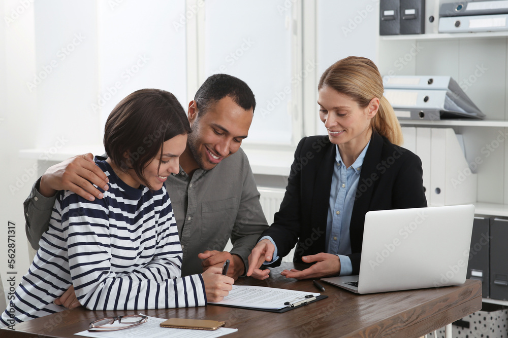 Couple consulting with professional notary in office Couple consulting with professional notary in office