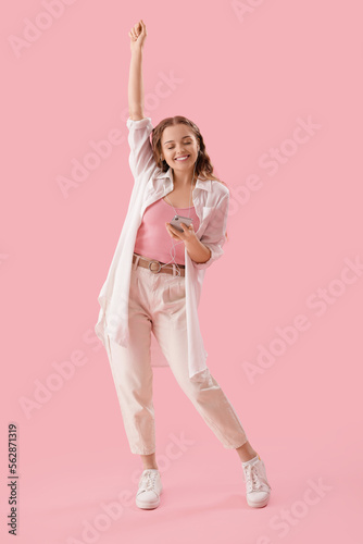 Young woman in earphones wi...