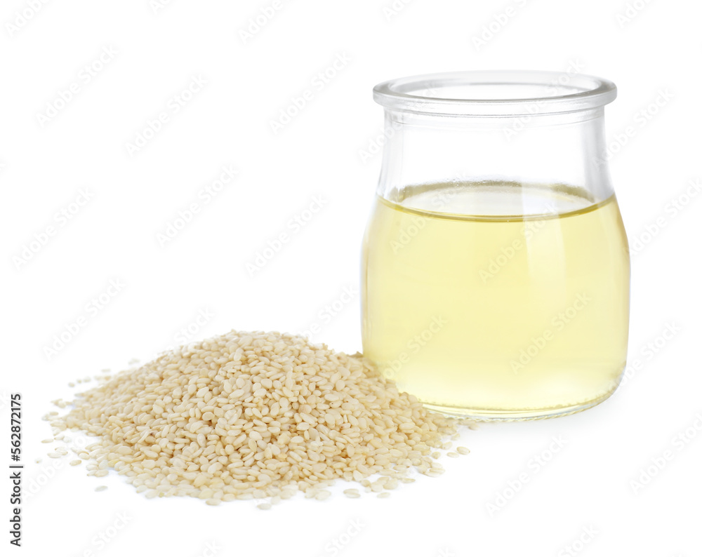 Glass jar with fresh sesame oil and seeds isolated on white Glass jar with fresh sesame oil and seeds isolated on white