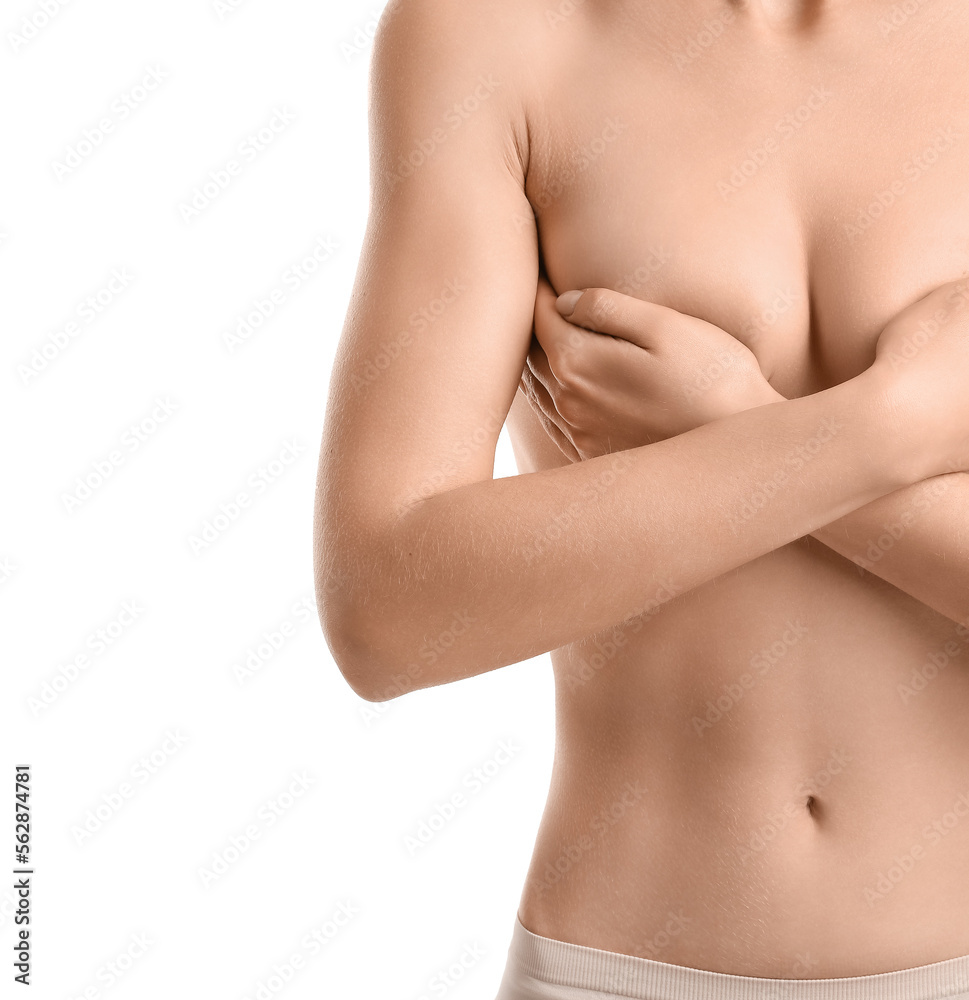 Naked young woman on white background, closeup. Breast cancer awareness concept