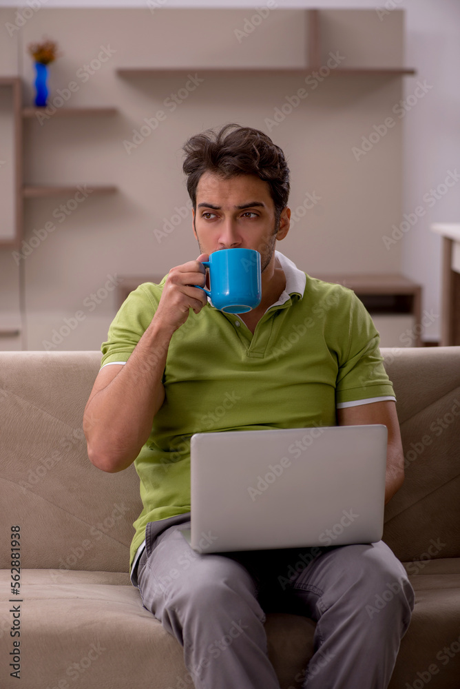 Young male freelancer working from home Young male freelancer working from home