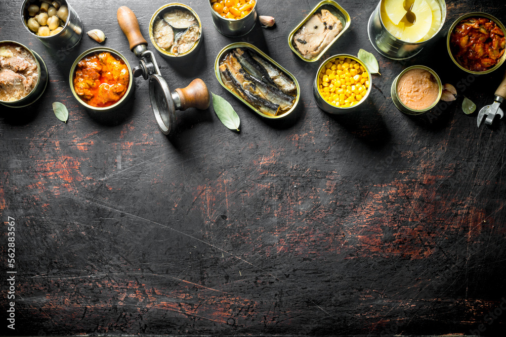 Group of different tin cans with canned food. Group of different tin cans with canned food.