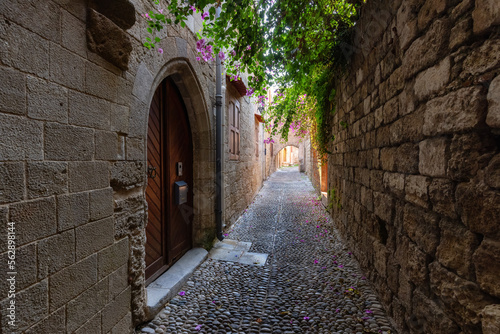 Fototapeta Naklejka Na Ścianę i Meble -  Streets and Residential Homes in the historic Old Town of Rhodes, Greece. Sunny Morning.