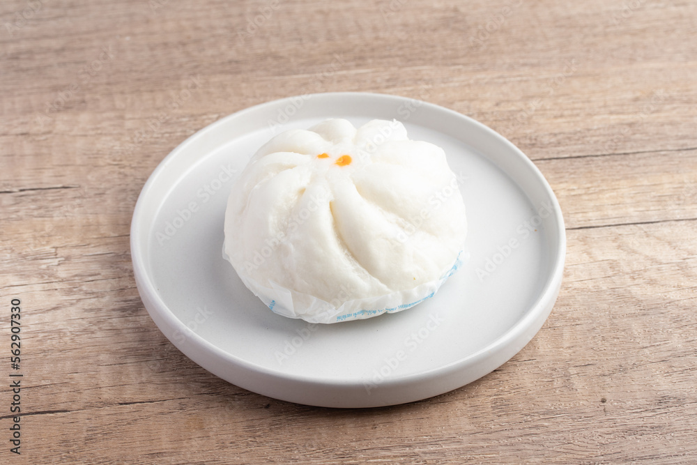 Steamed pork buns in a plate on a white background Steamed pork buns in a plate on a white background